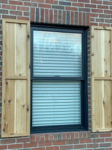 Custom built cedar shutters by EMA Construction for a project in Clarksville, OH